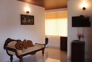 Living Room with Couch, washer/Dryer/ and TV