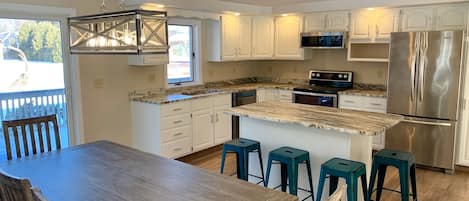 Newly remodeled kitchen with new flooring, appliances, granite, fixtures