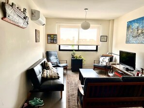 Living room with water view and large TV(not shown)