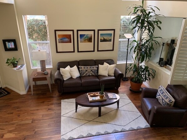 Bright living room with leather sofa and recliner