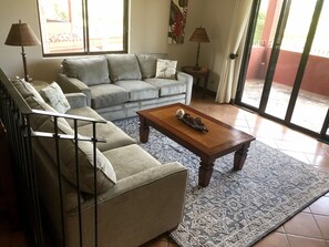 Plenty of comfortable seating in the bright and spacious living room.