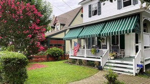 Front porch, rocking chairs, and pretty yard to enjoy a perfect Cape May day. 