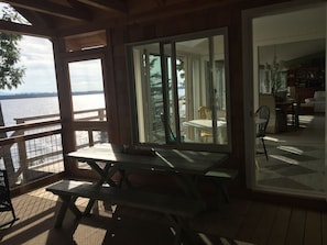 Picnic table on screened porch for meals and card games! Next to the kitchen.