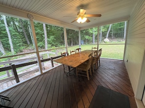 Screened-in back porch.  The "Big Kids Table".  Seats 12. Great forest view.