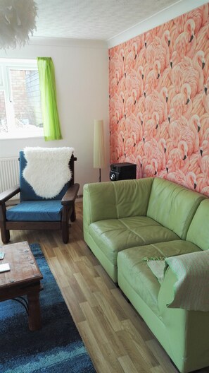 The light and airy sitting room with flamingos!