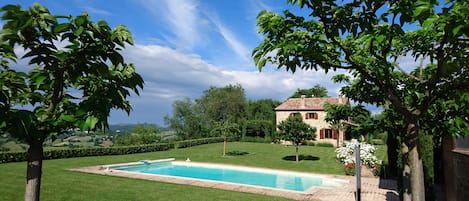 View over pool, garden and surrounding countryside