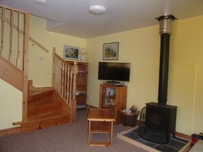 Living room with cosy woodburner