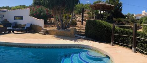 The pool, gardens & pergola have views over Javea Port and the Mediterranean Sea
