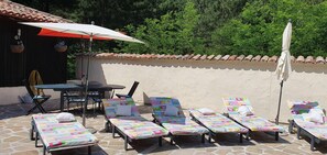 ample sunbeds and chairs, dine outside by pool