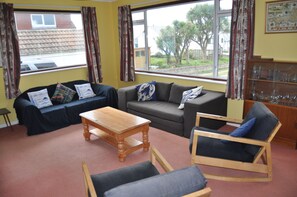 Living room (blue sofa, grey sofa bed)