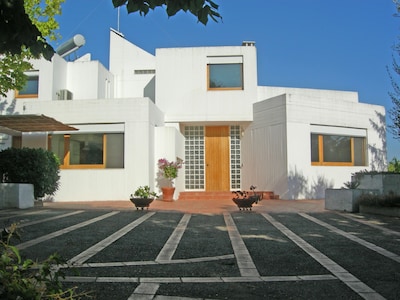 Refined modern architectural design villa in typical Apulian landscape.