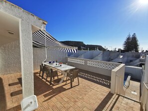 Black Rock and sea view from veranda with steps to pool area