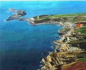 The coast with Clover Cliff  (arrowed)