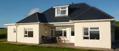 The house faces the sea with a sheltered verandah for out door eating. 