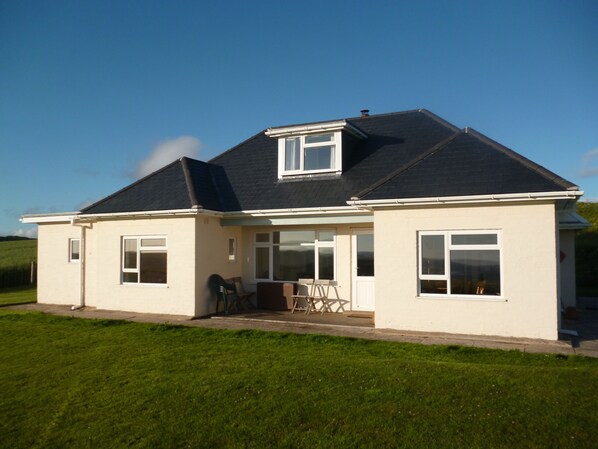 The house faces the sea with a sheltered verandah for out door eating. 