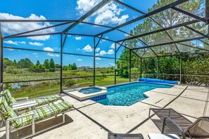 Pool with Spa giving uninterrupted views of the conservation lake