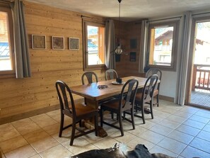 Dinning table sitting 8 persons. A total of 8 chairs is availble.