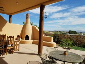 Outside tables and kiva