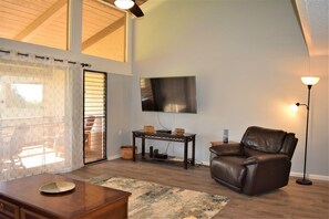 Open floor plan with cathedral ceiling