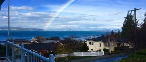 Front door view with spectacular rainbows over Camano & Whidbey islands