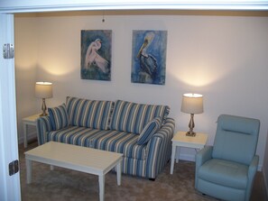 Living Room with fold out queen sleeper. French doors may be closed for privacy.