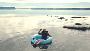 Tubing on the warm Bay waters. Tubes provided!