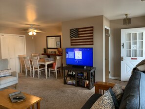 Family room - looking from the corner, you see dinning table and front door