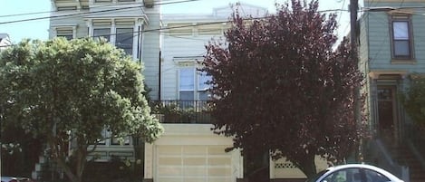 Street view; flat is located through the courtyard.