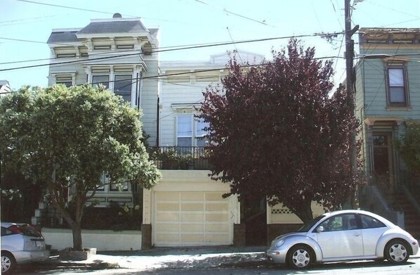 Street view; flat is located through the courtyard.  