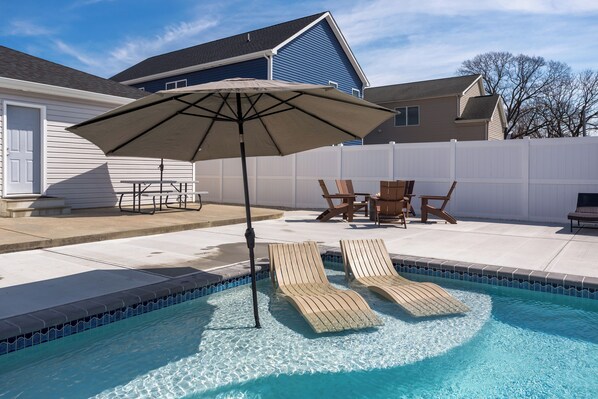 Fire Pit w/ Seating around the Pool. Large Overhang/Roof was added to the Rear Patio with Lighting and Ceiling Fan. Now the rear patio is shaded.