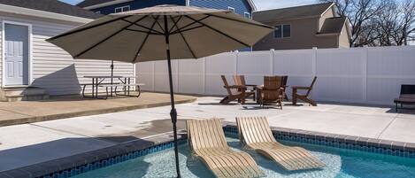 Fire Pit w/ Seating around the Pool. Large Overhang/Roof was added to the Rear Patio with Lighting and Ceiling Fan. Now the rear patio is shaded.