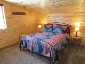 Upstairs bedroom with queen bed.