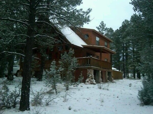 Cabin has wrap around deck and sits on one acre