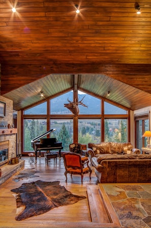 High ceilings & natural elements compliment the view from the living room.