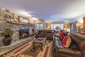 Huge living room (1000 sq. ft.), wood-burning fireplace, big TV, private hot tub