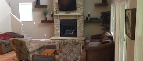 Beautiful gas fireplace with TV above. 