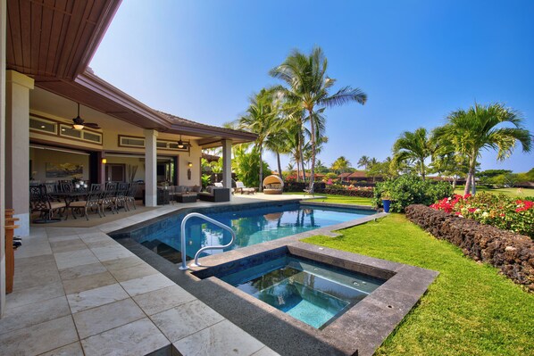 The ninth hole of the Hualalai course can be seen from the lanai and living area
