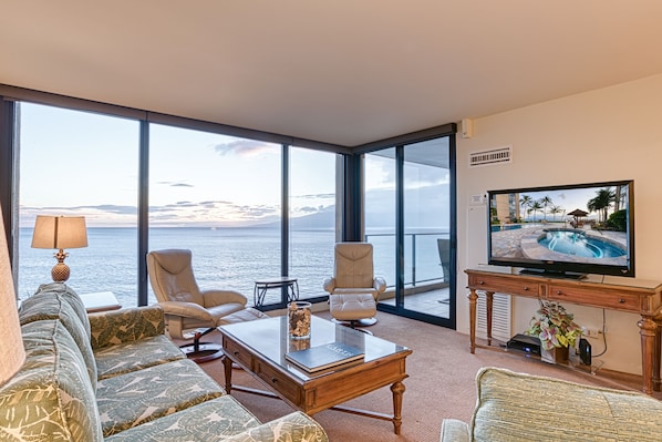 Living room looking out to the ocean through large floor to ceiling windows