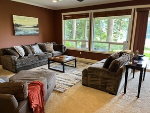 Wall to wall windows with a view of the lake
