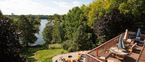 Perched high above Lake Schmidt, this home offers sweeping lake views from the spacious deck and the immaculate fire-pit patio.