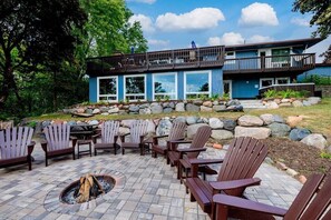 Enjoy a cozy fire while taking in lake views in these By The Yard adirondack chairs.