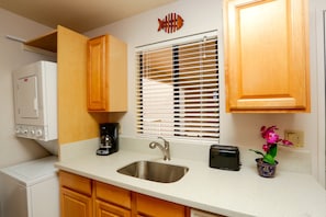 Complete kitchen with new solid quartz countertops.