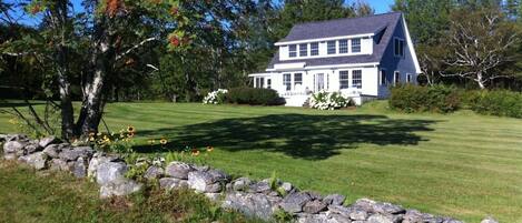 Charming Newbury Neck cottage set on many private wooded and oceanfront acres