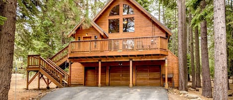 Cabin nestles on over a half acre of pristine pines full of squirrels and deer