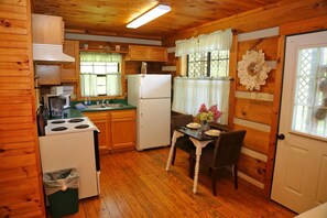 Kitchen with dishes and cookware.  Just bring the food!  