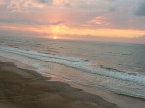 Morning coffee on the balcony with a beautiful sunrise.