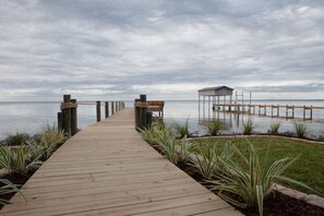 Custom dock with built-in seating & stairs down into the water