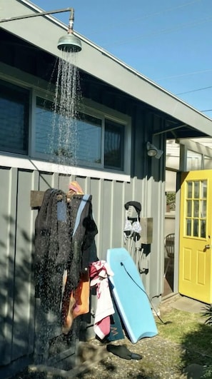 Outdoor shower with hot water in back yard