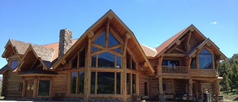 lodge front with deck, yard, fire pit area
