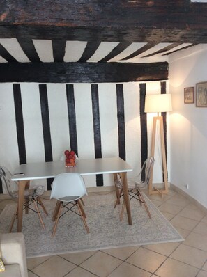 Ancient beams on ceiling in dining room and living room